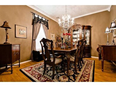 Dining Room. STUNNING describes formal dining with chandelier & ample room for ALL dining furniture. Dramatic!!