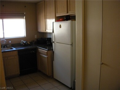 Other side of kitchen showing bifold door containi