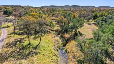 Drone / aerial view with a wooded view and a moun