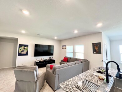Living room featuring recessed lighting and plenty of natural light