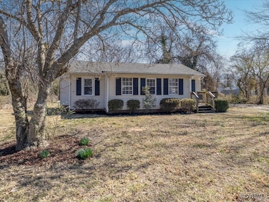 Ranch-style house featuring a front lawn