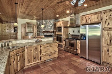Custom hickory cabinets with 48'dual gas stove wit