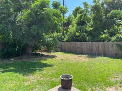 View of fenced backyard