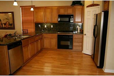 Kitchen with full-back splash granite countertops,