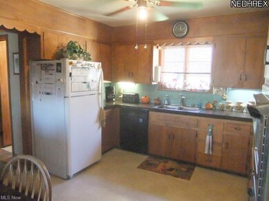 The kitchen offers plenty of cabinet and counter s