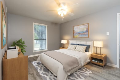 Bedroom with light hardwood / wood-style flooring 