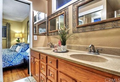 Hallway bathroom with connecting door to Master be