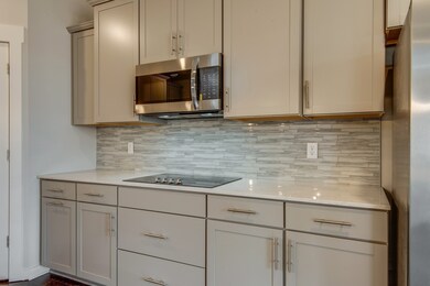 Stainless steel appliances (including refrigerator) are in this home. Not actual home but same cabinetry, countertops and appliances