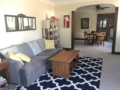 Large Living room with arched doorway.
