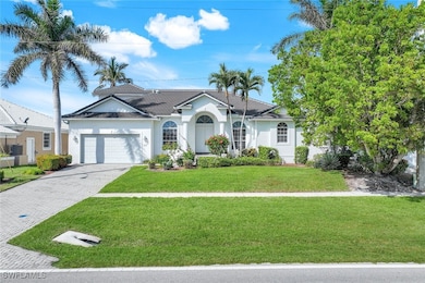 Ranch-style home with a garage and a front yard