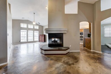 Living room featuring concrete flooring, a multi s