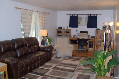 LIVING ROOM FROM FRONT DOOR ENTRY.  NOTE THE HARDW