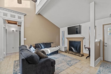 Living room featuring light tile patterned floors,