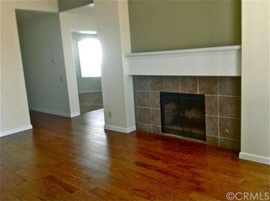 Living room with gas/wood burning fireplace. 2nd b