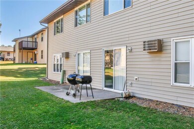 Lower units walk out to a shared concrete patio.