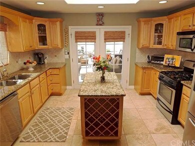 Remodeled kitchen with island and French doors tha