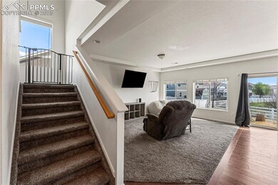Stairs featuring wood-type flooring, baseboards, a