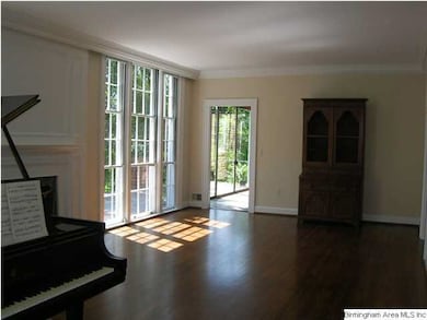 ANOTHER VIEW OF LIVING ROOM LOOKING TOWARD THE SUN