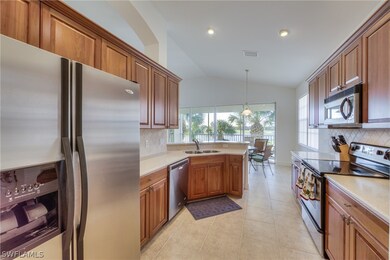 Stainless appliances and real wood cabinets.