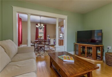 The living room and dining room have gleaming bamb