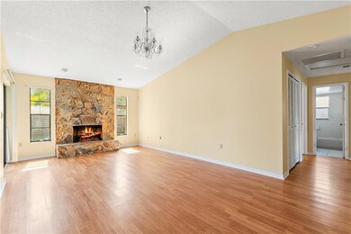 Same room shown empty. Bedrooms to the right, dini