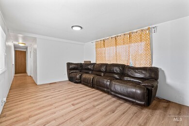 Living area with light wood-style flooring