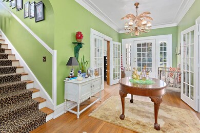 Large foyer looking toward front door. Double Fren