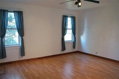 Living Room looks out onto large level yard.