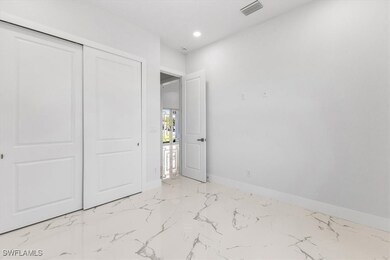 Unfurnished bedroom featuring baseboards, recessed