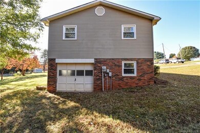 Side load garage offers great space for workshop, lawn equipment storage and rec space.
