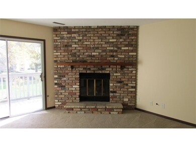 Gas burning fireplace in living room and sliders t