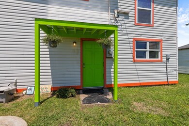Custom built covered porch with corrugated tin roo
