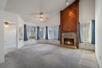 Unfurnished living room featuring carpet floors, a
