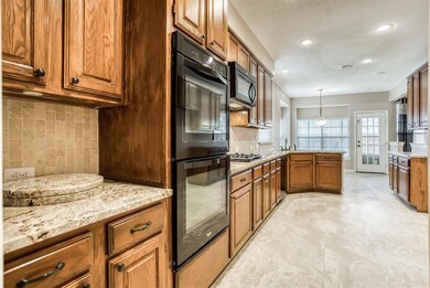 The updated kitchen features abundant 42-inch uppe