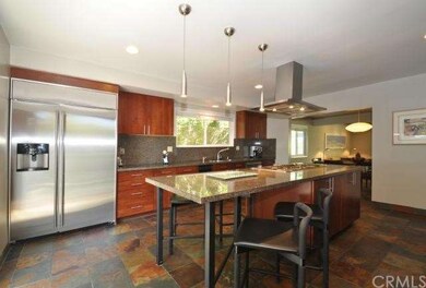 Another view of gourmet kitchen with large stainle