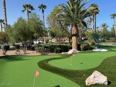 Surrounding community featuring a putting green an