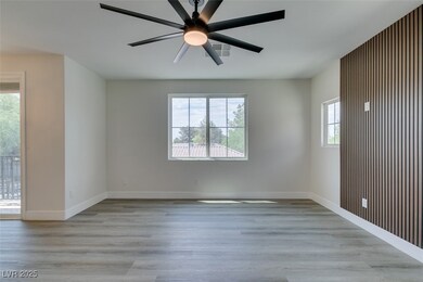 Spare room featuring light wood-style flooring and ceiling fan