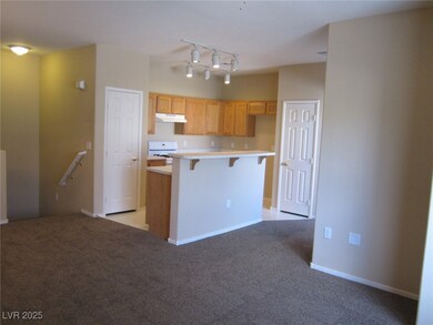 Kitchen with track lighting, a kitchen breakfast b