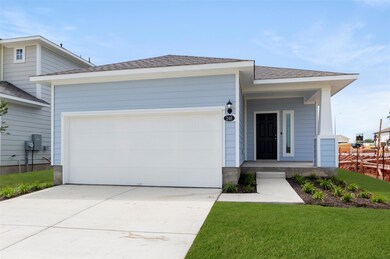 View of front facade with driveway, an attached g