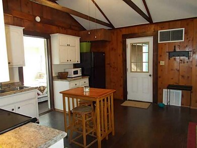Kitchen. anoather view of kitchen and back door to