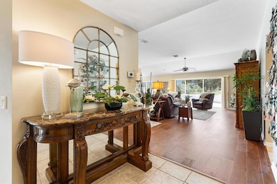 Foyer looking toward living room with engineered hardwood floors.