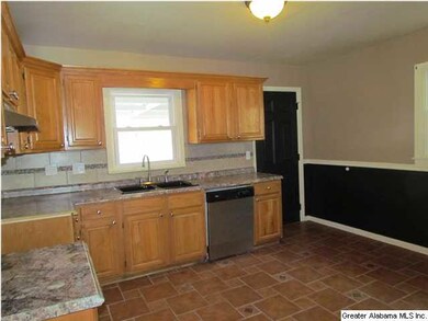 Kitchen with new counter tops, tile back splash an
