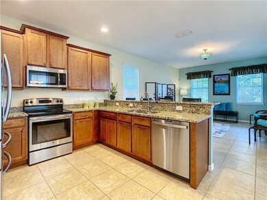 A Home Maker dream kitchen overlooks the Family Ro