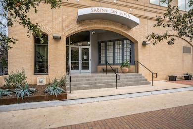 Property entrance with brick siding and french do