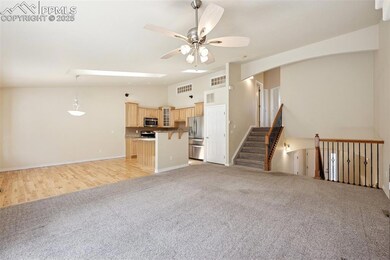 Unfurnished living room with light colored carpet,