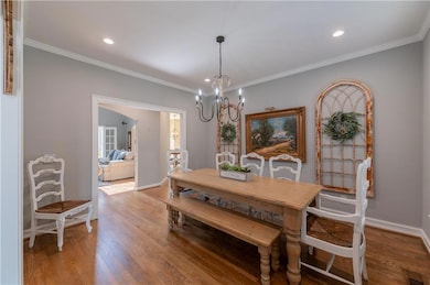 Dining area featuring ornamental molding, visible 