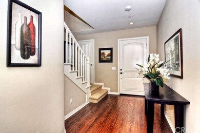 Elegant entry with rich wood grain laminate floori