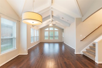 Unfurnished living room with dark wood-type floor