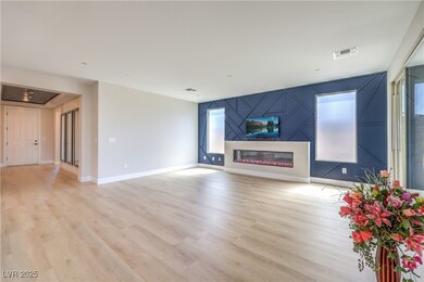 Unfurnished living room with light wood-style floo