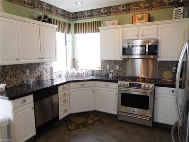 Beautiful kitchen with tile backsplash and floors!